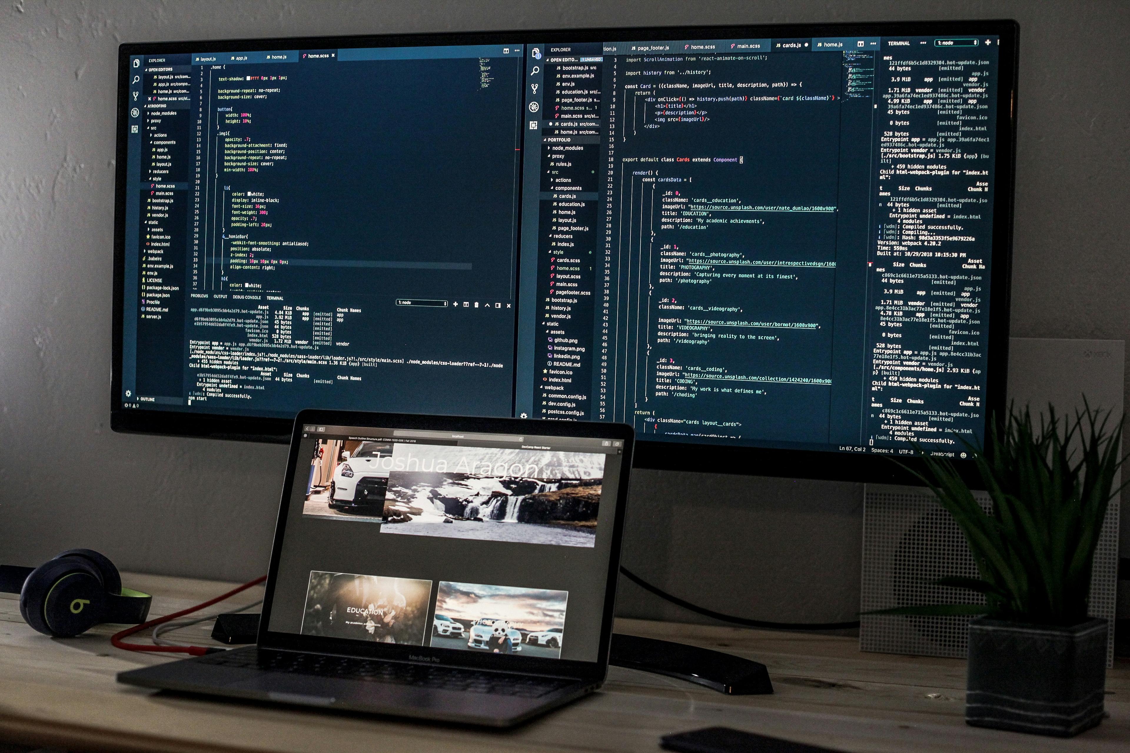 Photo of a code snippet in a monitor and a laptop, courtesy of Unsplash